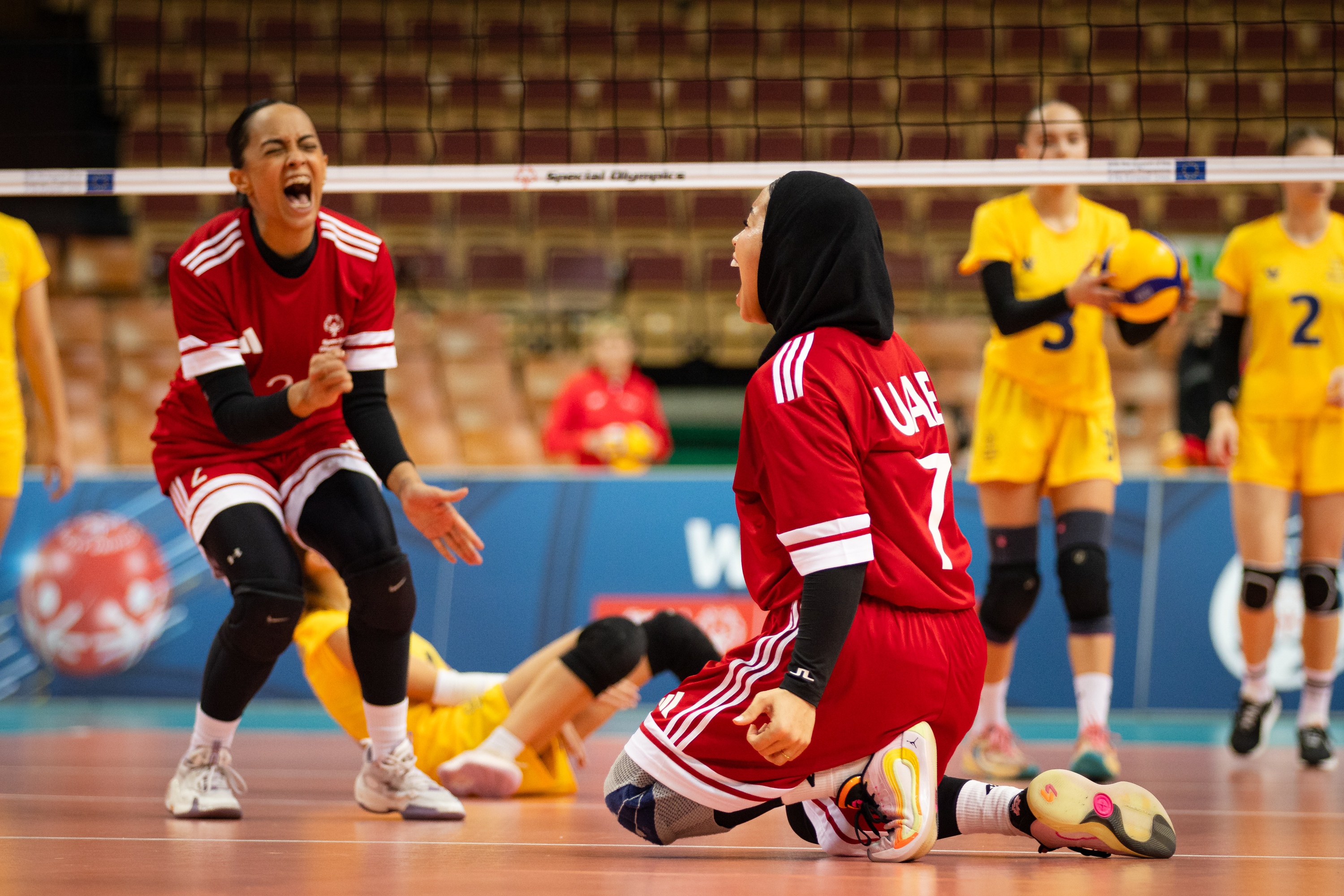 Players celebrating a point on court
