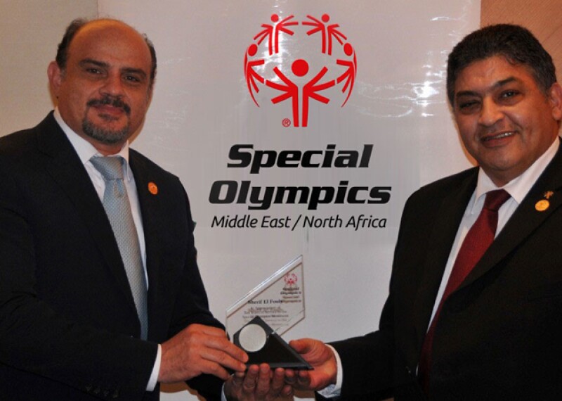 Ayman Wahab and Sherif El Fouly of Special Olympics Middle East North Africa pose in Inclusion Revolution Radio logo.