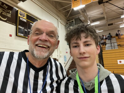 Two referees standing side by side. 