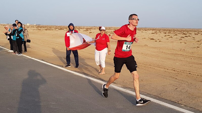 Francis Mauro, Special Olympics Gibraltar runner, running through the Abu Dhabi desert.