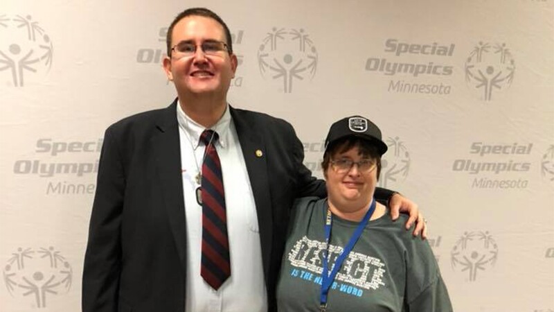 Kayte Barton standing next to Jason Gieschen for a photo together.