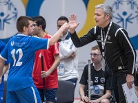Athlete in jersey no. 12 gives Urban Karlsson a high-5 during a game. 