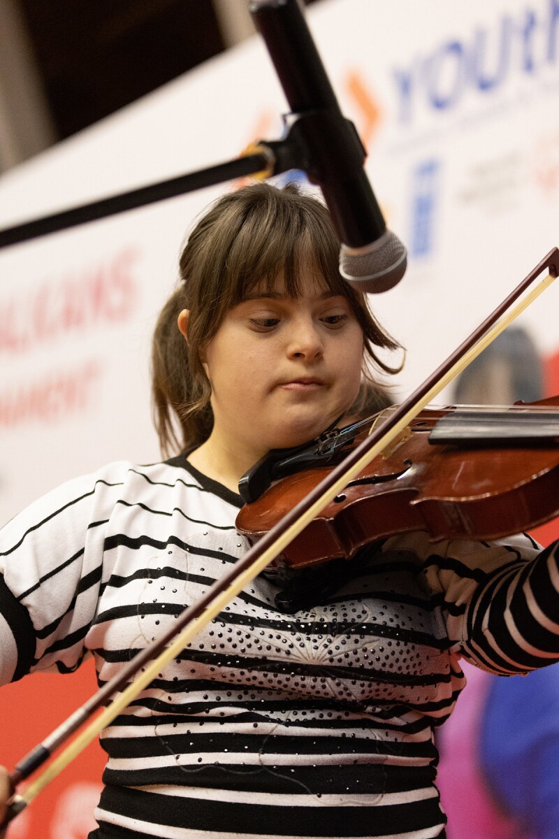 Special Olympics Albania athlete Dea Caushi playing the violin