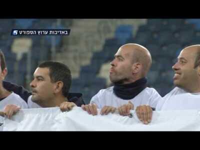 Special Olympics Israel athletes escort championship players onto the pitch