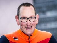 Portrait photo of smiley man wearing Special Olympics Netherlands uniform