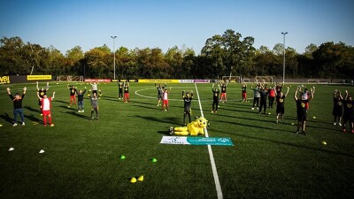 a team on the field spread out for a group photo