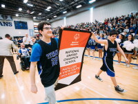 Students carry the Unified Champion School Banner at Papillion A Vista South High School