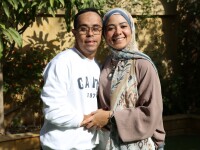 Young man and woman smile for a photo. 