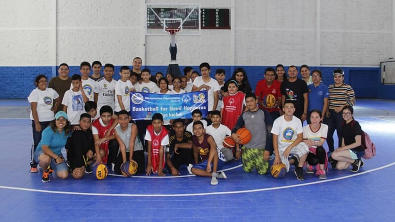 A group of young unified athletes together for a photo.