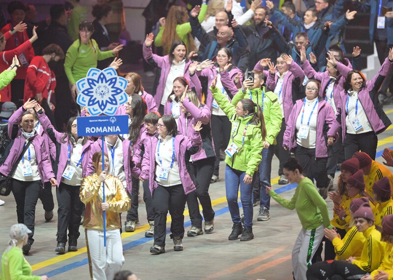 Delegation of Special Olympics Romania athletes marching into the stadium at the Opening Ceremony of the World Winter Games Turin 2025.
