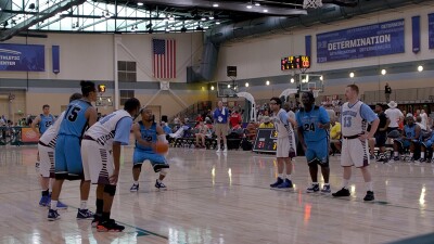Man making free through on the basketball court. 