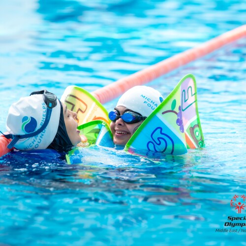 Swimmers swimming in a pool