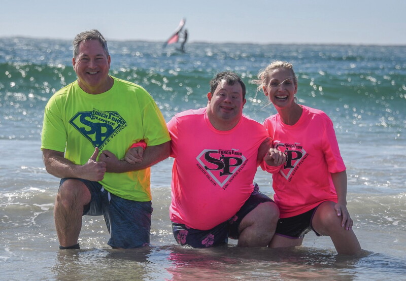 Elwood Johnson with athlete and super plunger