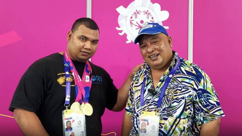 Two men stood side by side facing 