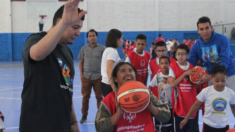 Group of young athletes practicing on the court.