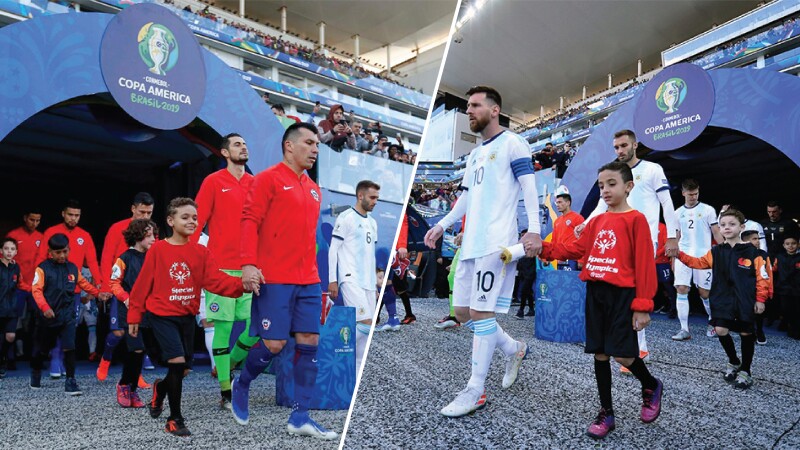 Two pictures edited into one, a team of unified players walking out of onto their side of the field.