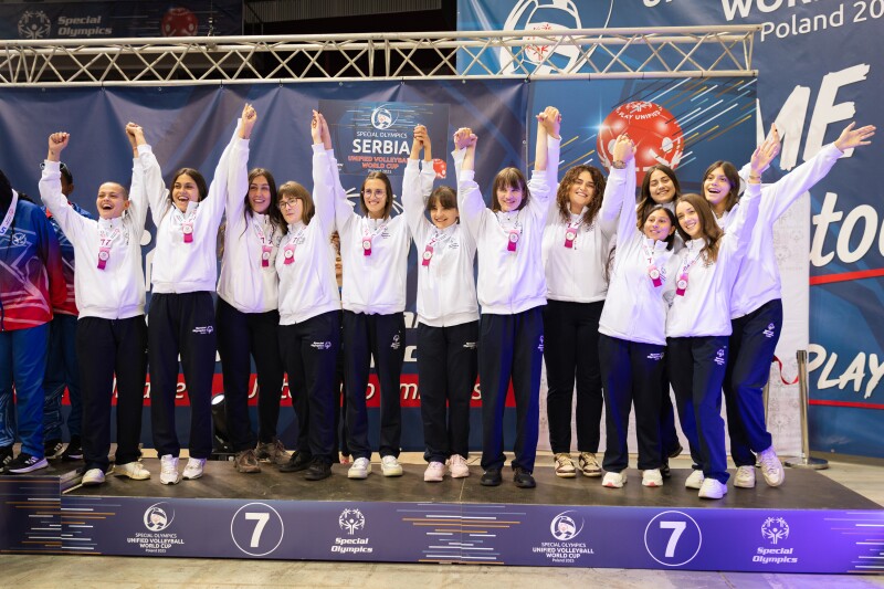 Serbia’s Women’s Team stands on the podium after receiving their 7th place ribbons