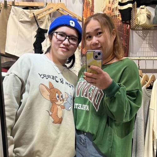 Hsin Wen Tzu with her mother, Zheng as they take a mirror selfie standing next to each other