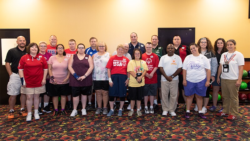 Cindy Schopper stands with the Special Olympics Bowling Team.