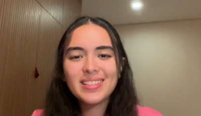 Girl smiling and videoing herself.