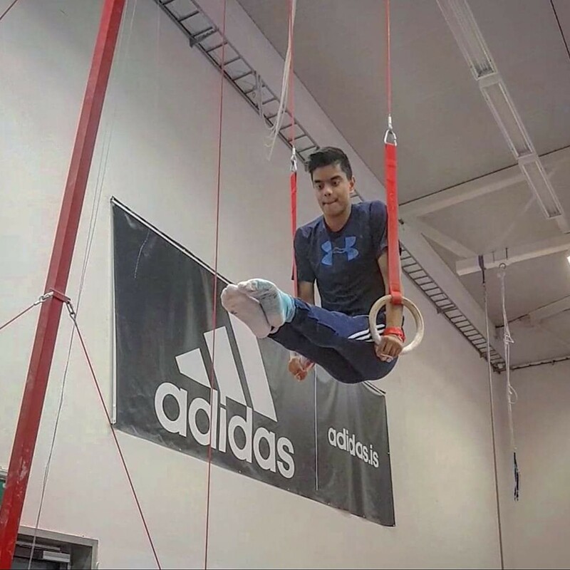 Magnus performing on the rings.