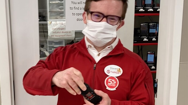 Steven at work wearing his red Target zip up. 