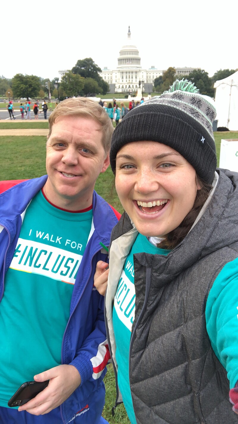 Megan Jean and Robby "Bobby" Jones at the Best Buddies Walk on the National Mall in front of the United States Capitol. Both Megan and Bobby have on turquoise Best Buddies t-shirts that say "I Walk for Inclusion".