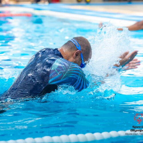Swimmers swimming in a pool