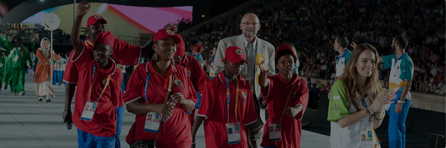 Eswatini delegation and representatives walking on stage during a games opening.