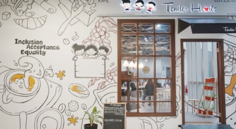 The outside of a cafe with a sign which reads 'Tender Hearts'