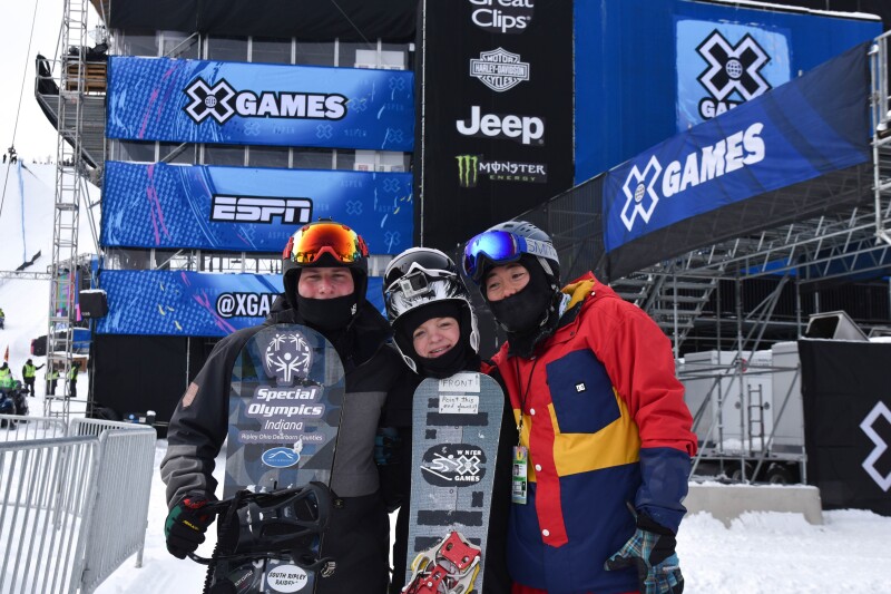 Chris Perdue, Daina Shilts and Henry Meece standing side by side in their winter gear fora group photo.