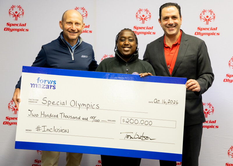 Three people holding a large-size check. 