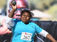 Woman throws shotput