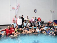 Group photo in a swimming pool. 