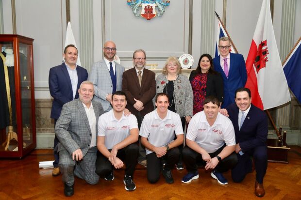 A group of eleven people posing for a picture
