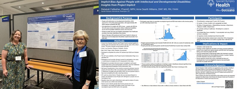 Two women stand in front of a poster board as they present a poster titled, “Implicit Bias Against People with Intellectual and Developmental Disabilities: Insights from Project Implicit.”
