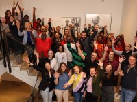 Drew McIntyre and Special Olympics HQ staff standing on a staircase. 