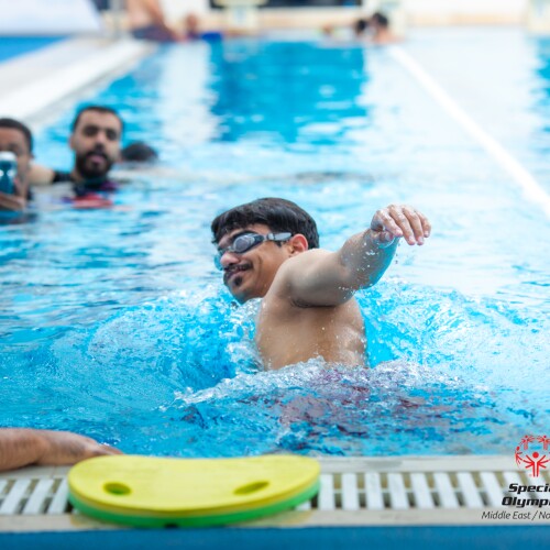 Swimmers swimming in a pool