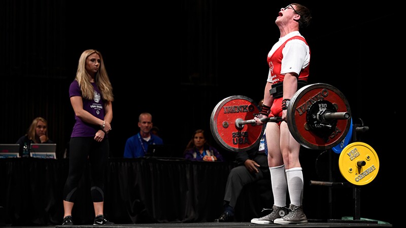 Athlete Mitchell Betsworth deadlifts on stage at the 2018 USA Games.