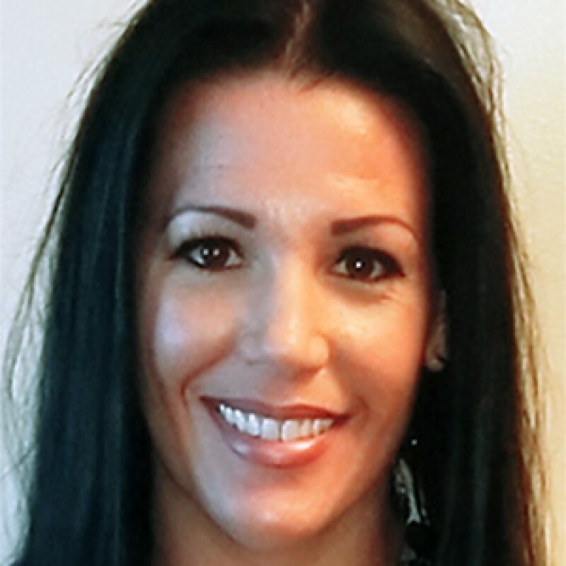 Olivia Contreras smiling in a portrait photo