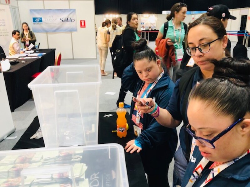Sayra Paola Barrios, Special Olympics Guatemala Gymnastics athlete, patiently waits to receive her new prescription glasses from the Special Olympics-Lions Club International Opening Eyes Program. 