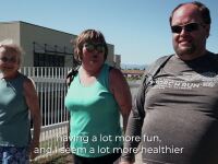 Three people walking outside