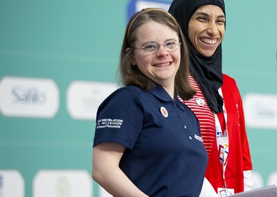 Hanna Atkinson and Zalikha Almansoori standing on stage together. 