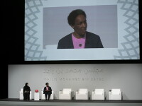 Loretta on stage speaking