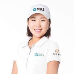 In-Kyung Kim smiling and wearing a power global branded polo