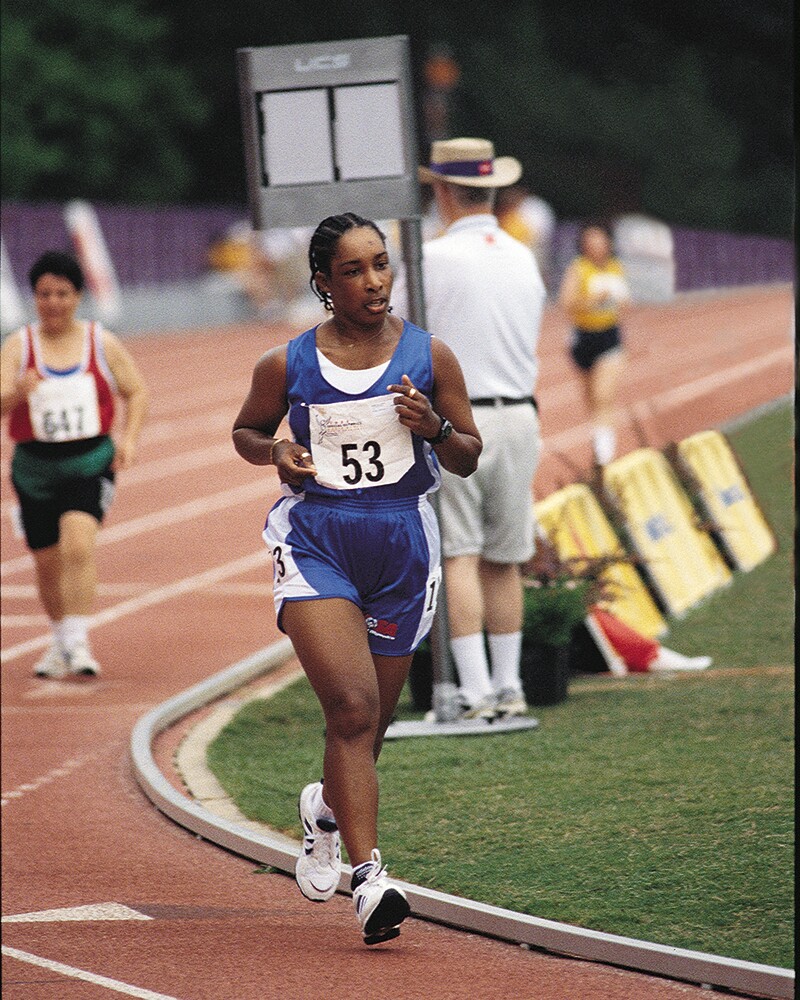 Loretta runs on a track.