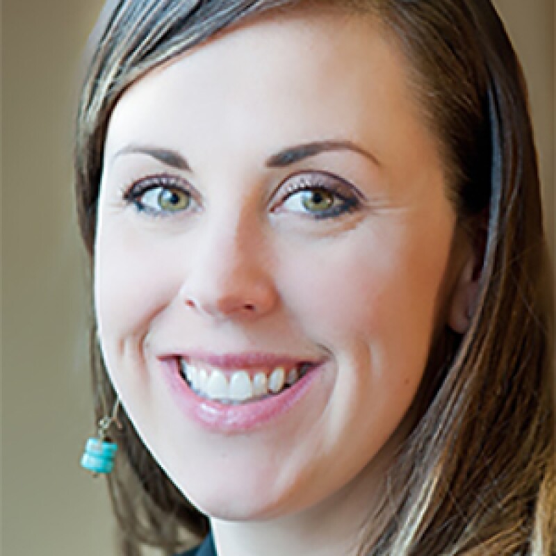 Angie Fraize smiling for a portrait photo.