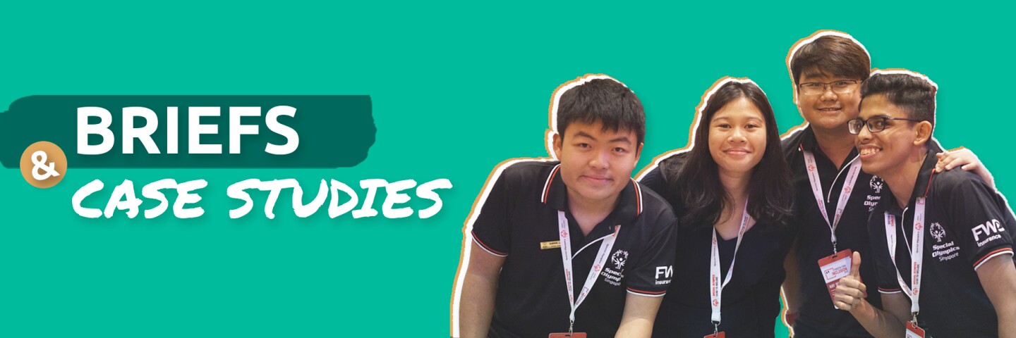 4 Youth Leaders pose for a photo. The background includes text that says "Briefs and Case Studies."