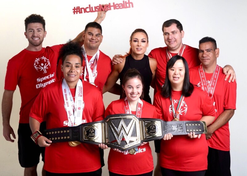 School of Strength Athletes pose with WWE Superstar Becky Lynch 