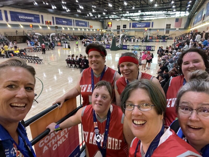 An all-female Special Olympics basketball team poses for a photo. 